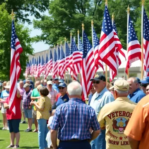 Outdoor event celebrating Medal of Honor recipients with flags and community members.
