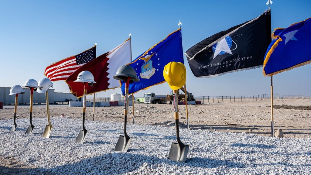 Ceremonial groundbreaking shovels and hard hats with flags